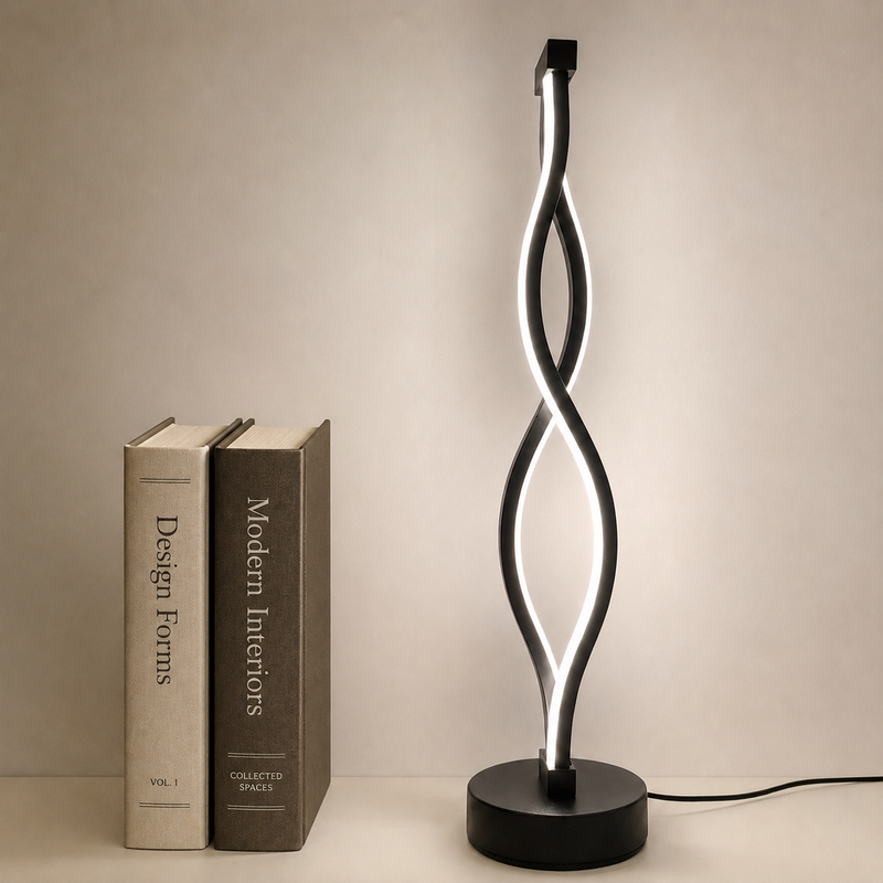 Ribbon Table Lamp in black, lit, beside books