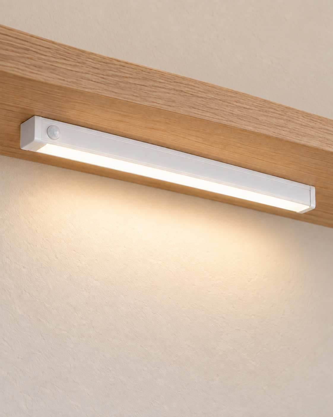 Rechargeable Motion Sensor LED Light Bar with a continuous diffuser on a shelf